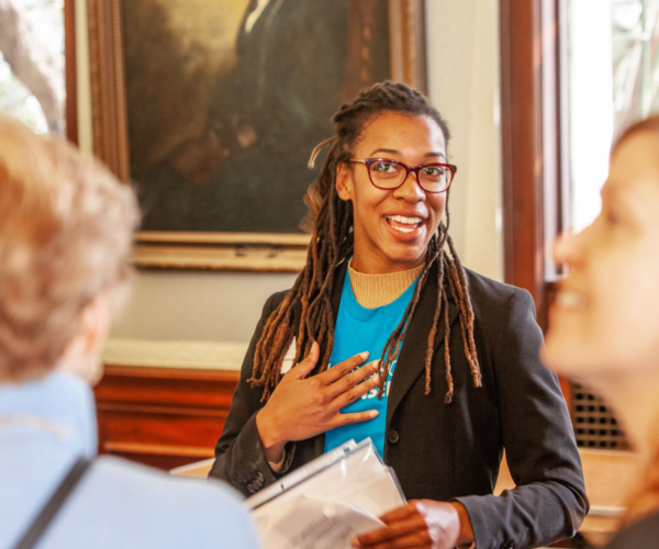 Tour guide shares history of the Ebell to tour goers.